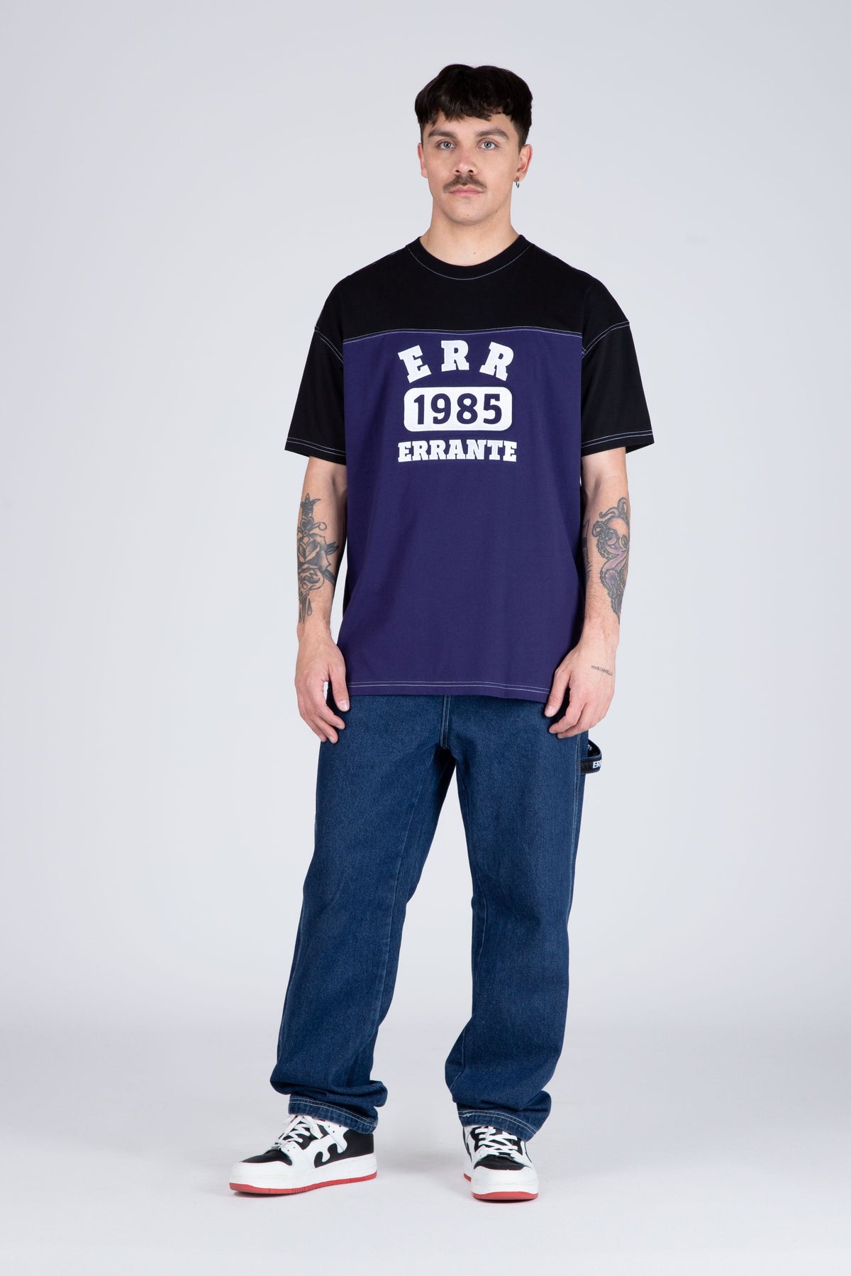 Polera M/C Nomad Morado/Negro ERRANTE