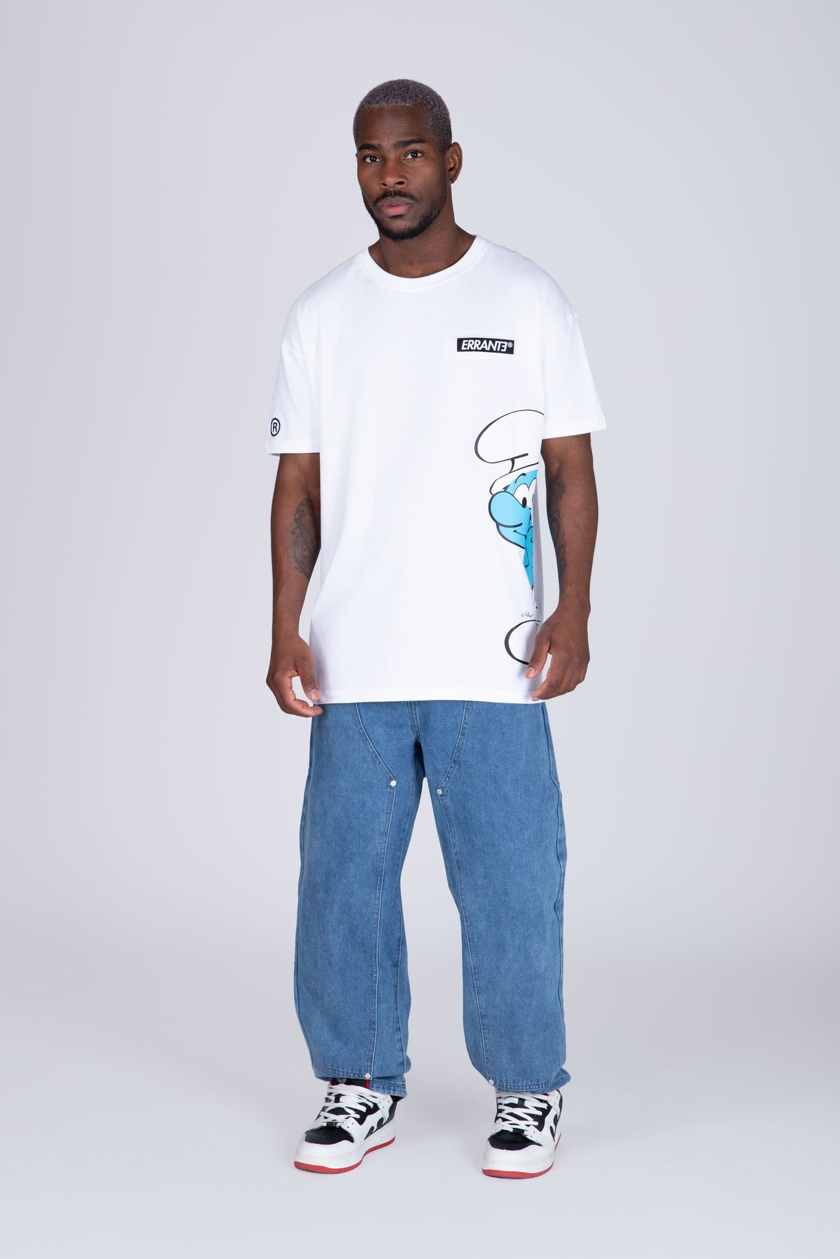 Polera Manga Corta Pitufos Peeking Blanco ERRANTE